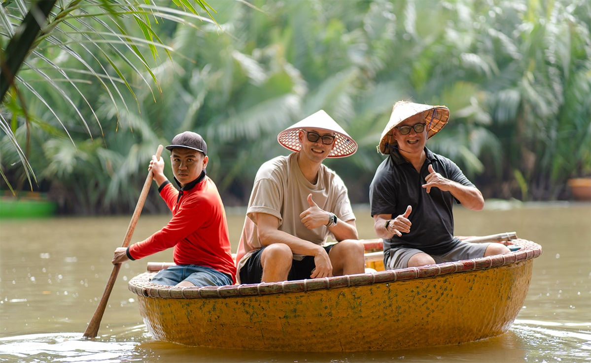 Travelers riding a boat on a Hoian tour