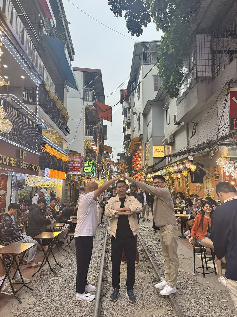 A group of tourist in the iconic Hanoi train street